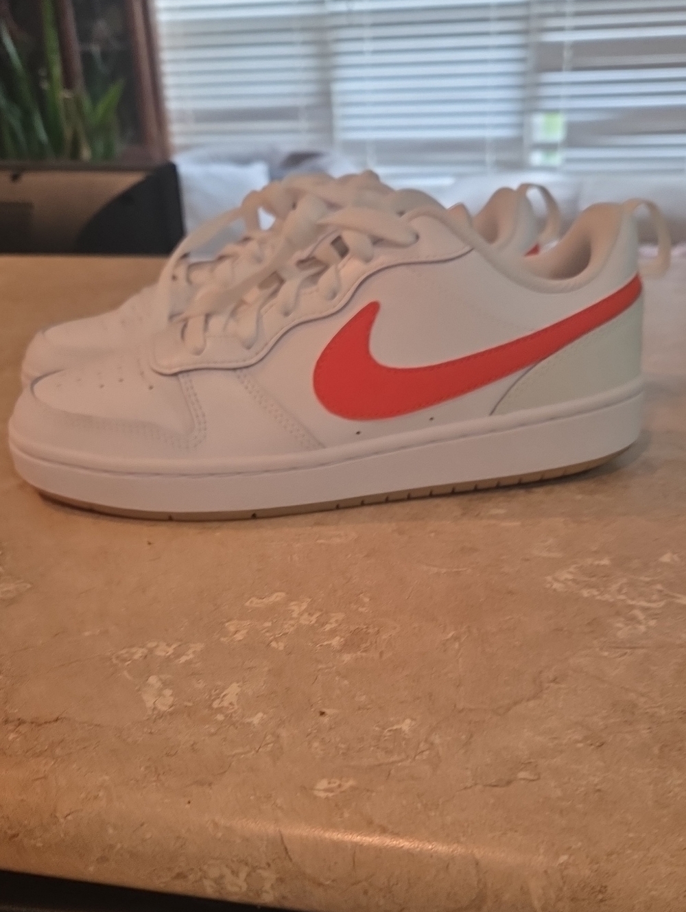 Nike Kids White Low-Top Sneakers with Bright Red Swoosh